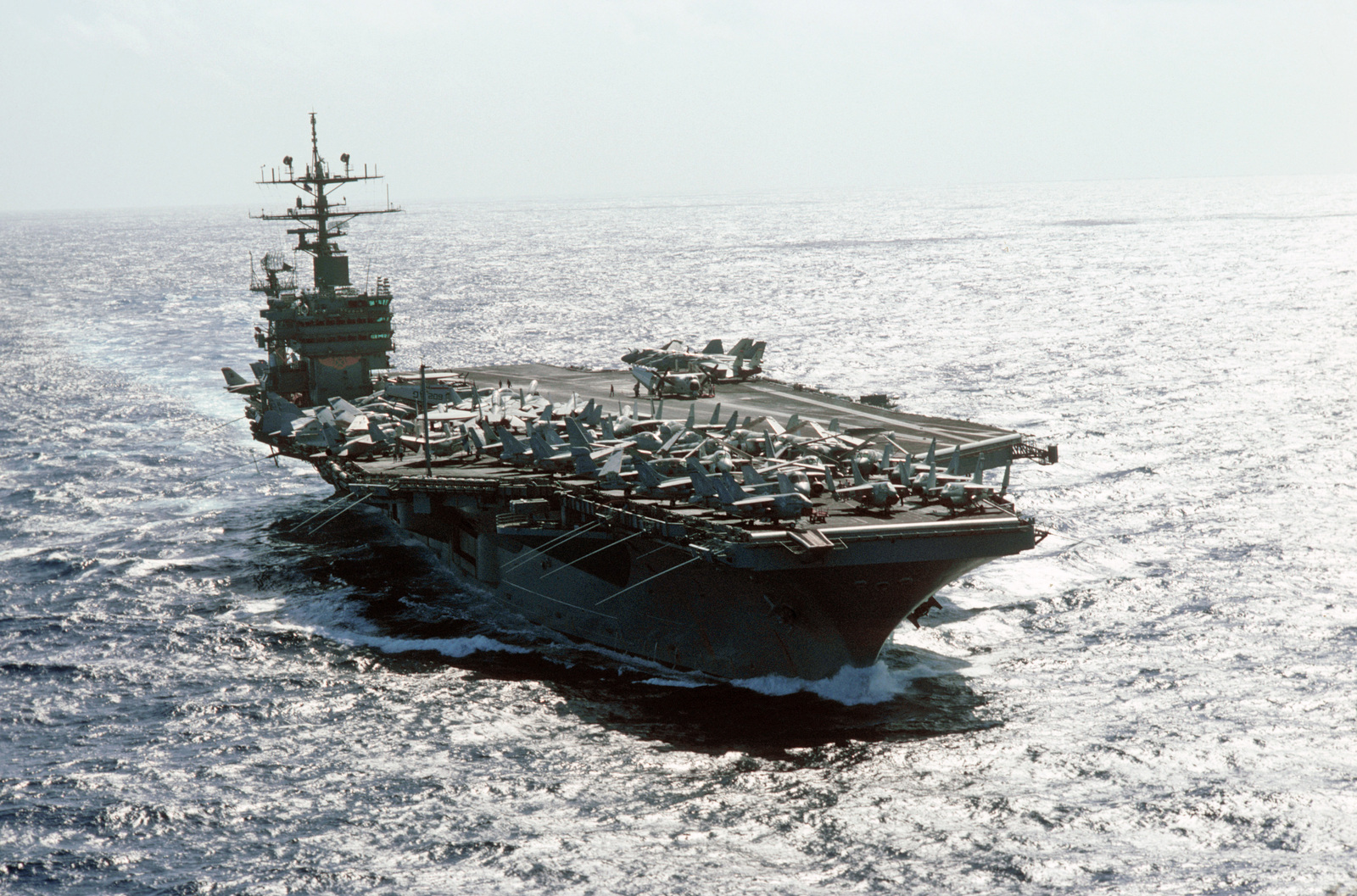 A starboard bow view of the nuclear-powered aircraft carrier USS DWIGHT ...