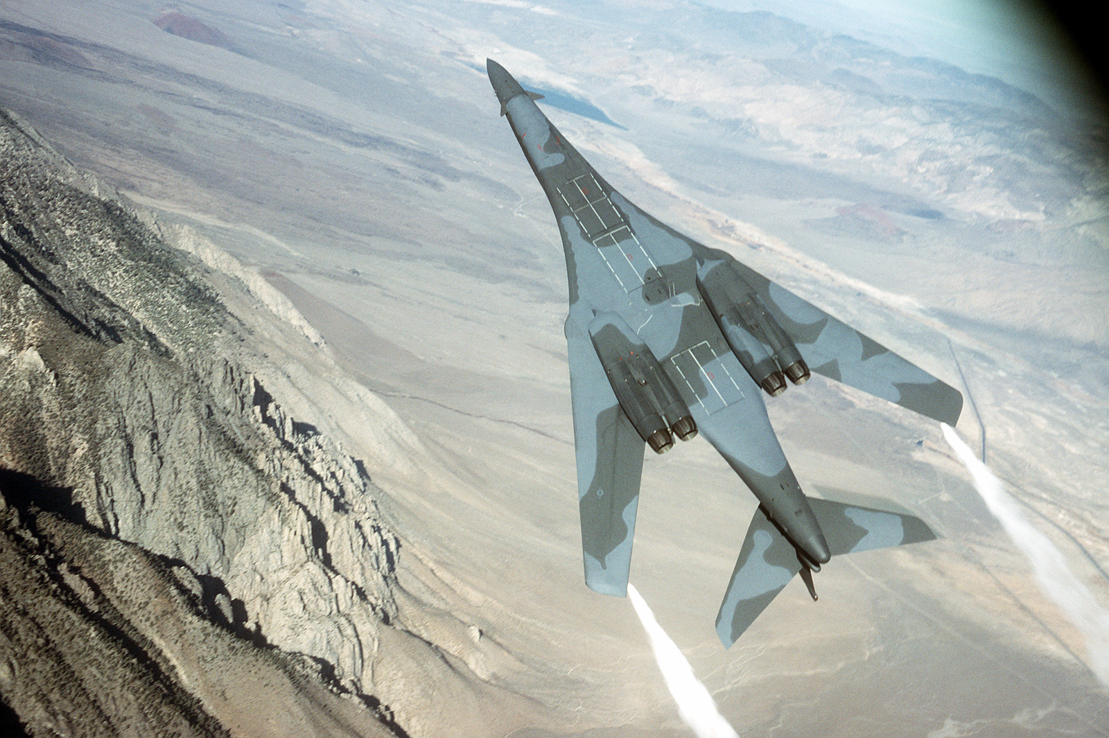 An Air-to-air Underside View Of A B-1B Bomber Performing An Evasive ...