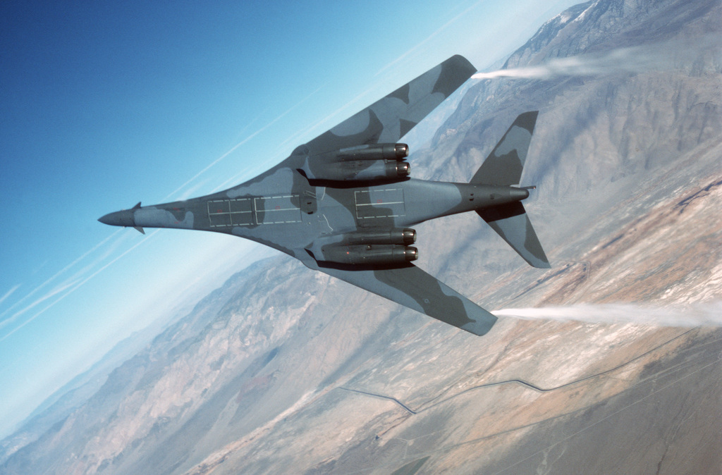 An Air-to-air Underside View Of A B-1B Bomber Performing An Evasive ...