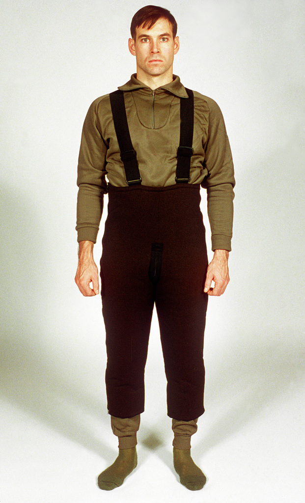A soldier models the polyester bib overall worn over polypropylene ...