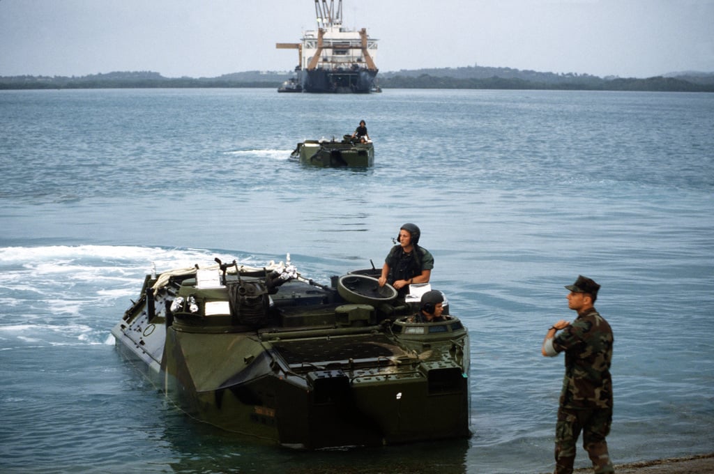 Marines come shore in AAVP-7A1 assault amphibian vehicles as a harbor ...