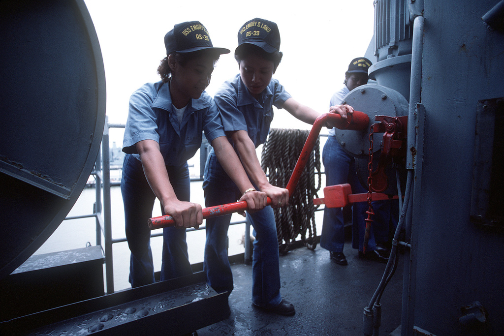 US Navy Engineman 2nd Class Anthony Bartelli (right) holds an