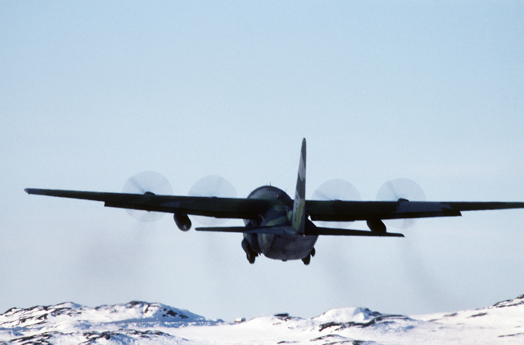 A C 130H aircraft loaded with sledge dogs leaves for Thule Air