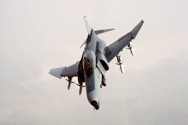 An air-to-air front view of an F-4G Wild Weasel Phantom II aircraft ...