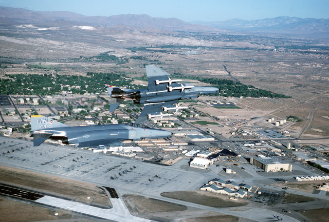 An air-to-air right side view of two F-4G Wild Weasel Phantom II ...