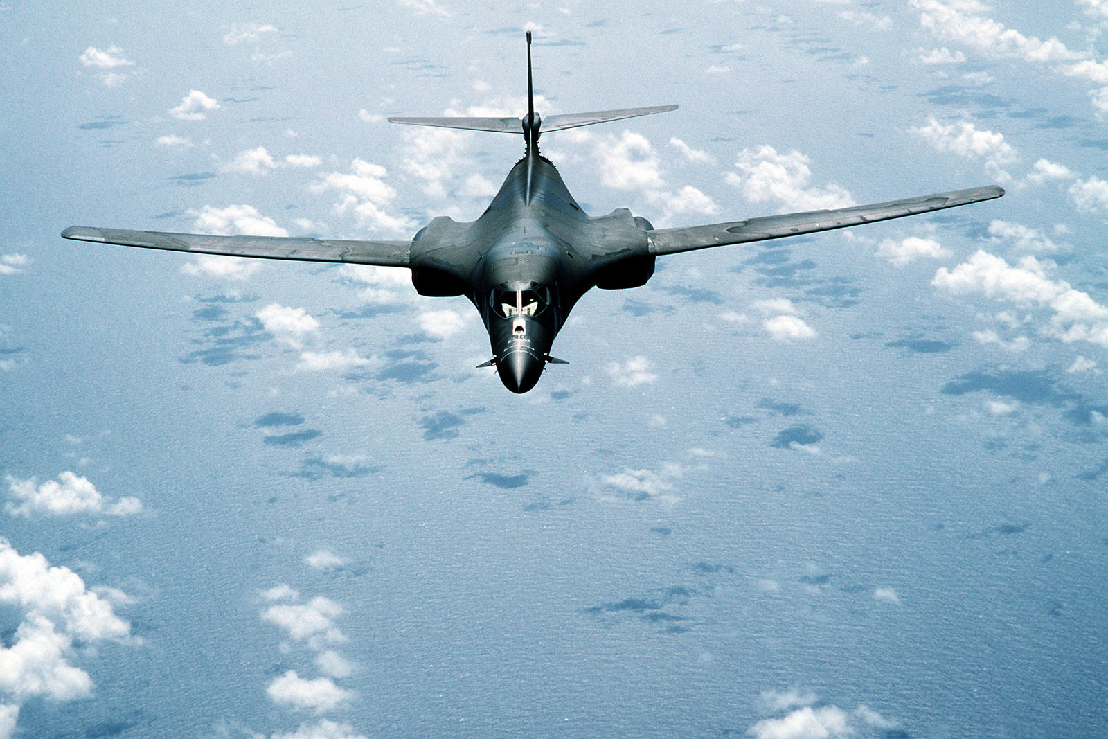 An Air-to-air Front View Of A B-1B Aircraft During Exercise Distant ...