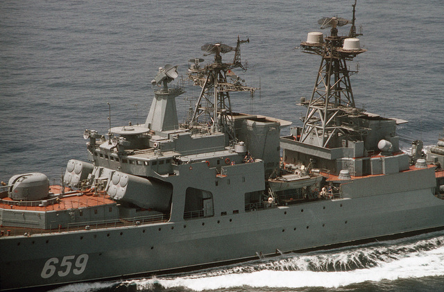 A port view of a 100 mm dual-purpose gun, SS-N-14 missile launchers and ...