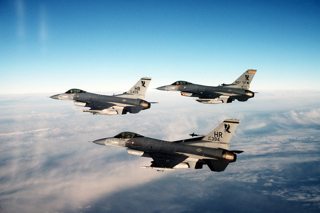 An air-to-air left side view of two 10th Tactical Fighter Squadron and ...