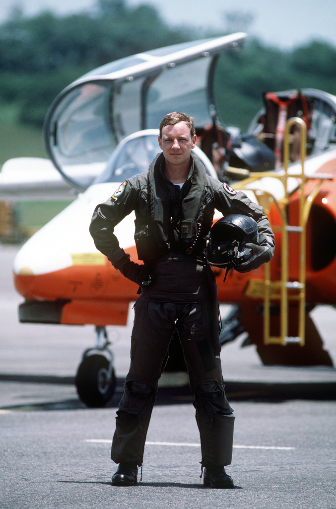 CPT Dave Elliott stands in front of an Italian-built SIAI-Marchetti S-211  trainer aircraft which he flies as an exchange pilot with the Singapore air  force - NARA & DVIDS Public Domain Archive