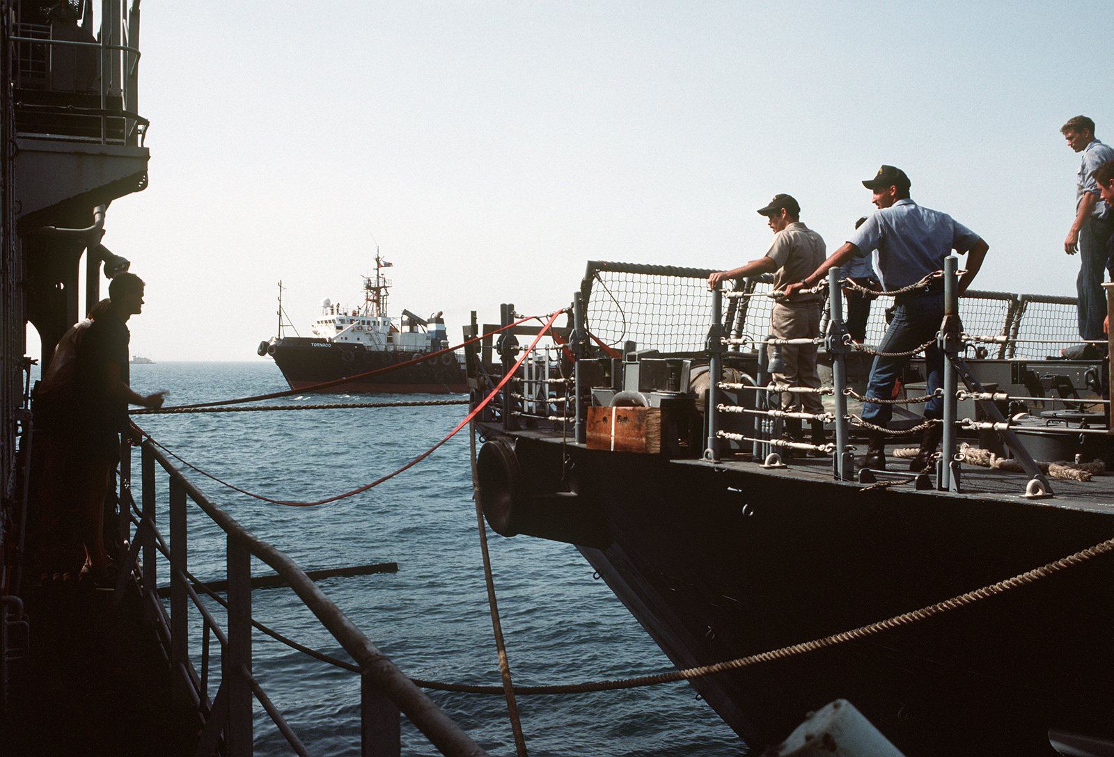 A Tug Maneuvers The Guided Missile Frigate USS SAMUEL B. ROBERTS (FFG ...