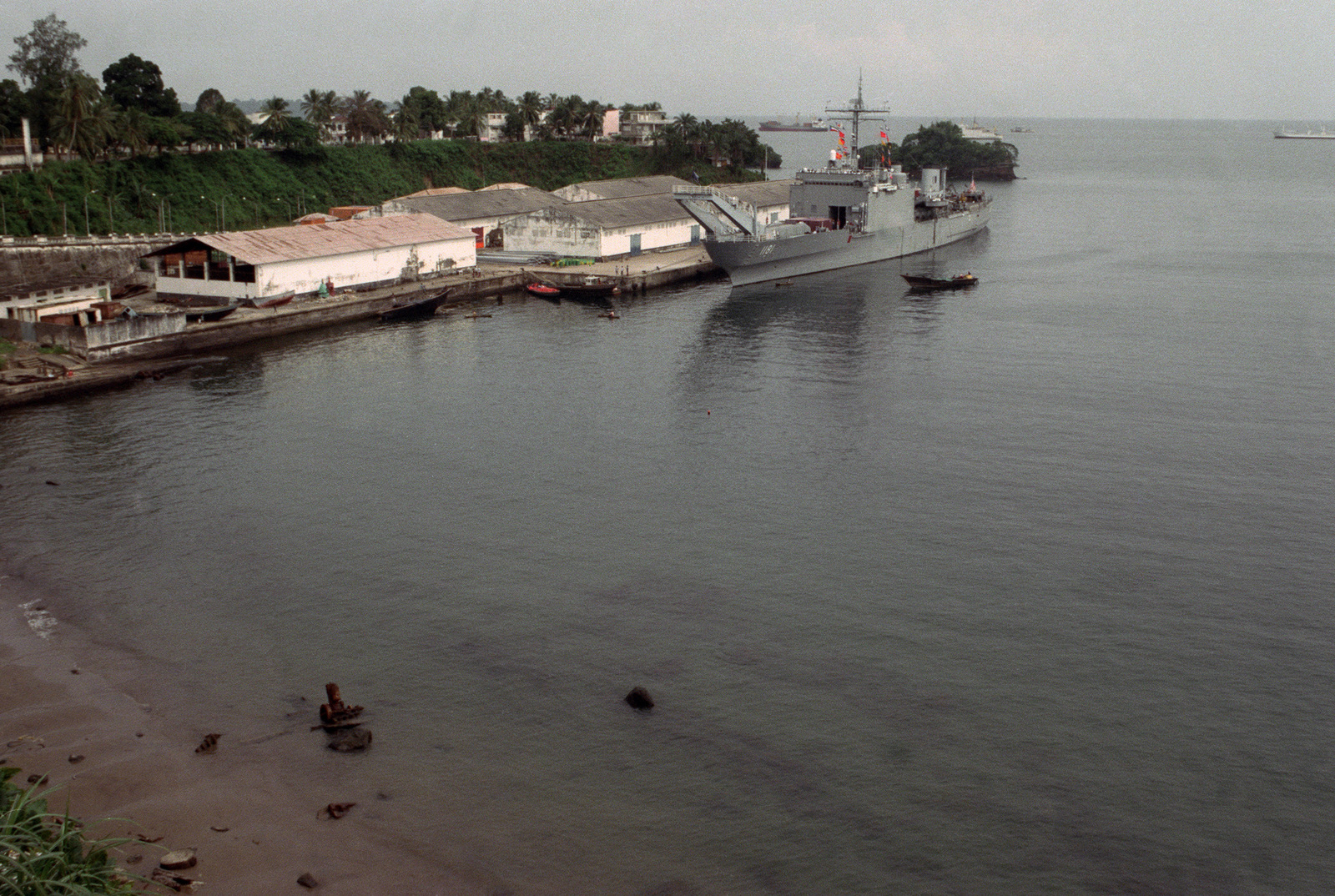 A view of the tank landing ship USS SUMTER (LST 1181) tied up at port ...