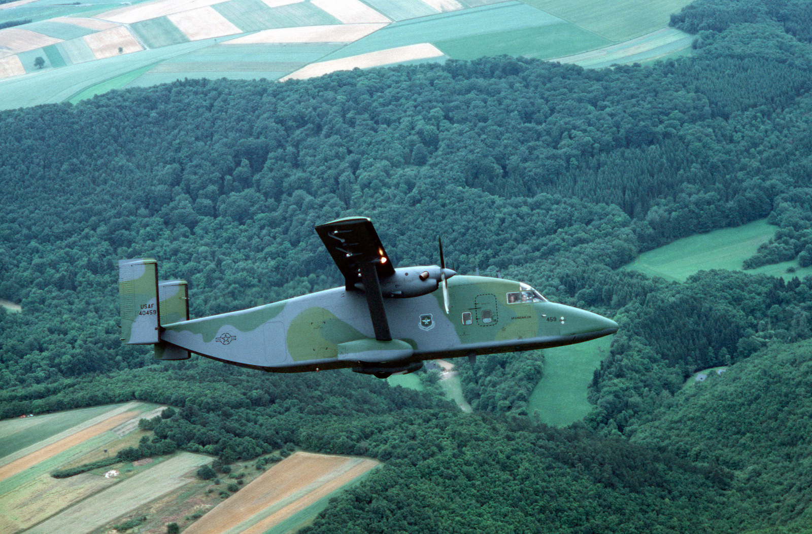 An air-to-air right side view of a 10th Military Airlift Squadron C-23A ...