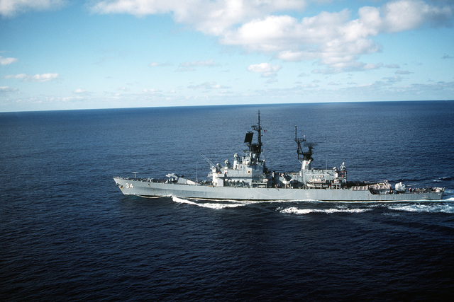 A port view of the guided missile cruiser USS BIDDLE (CG-34) underway ...