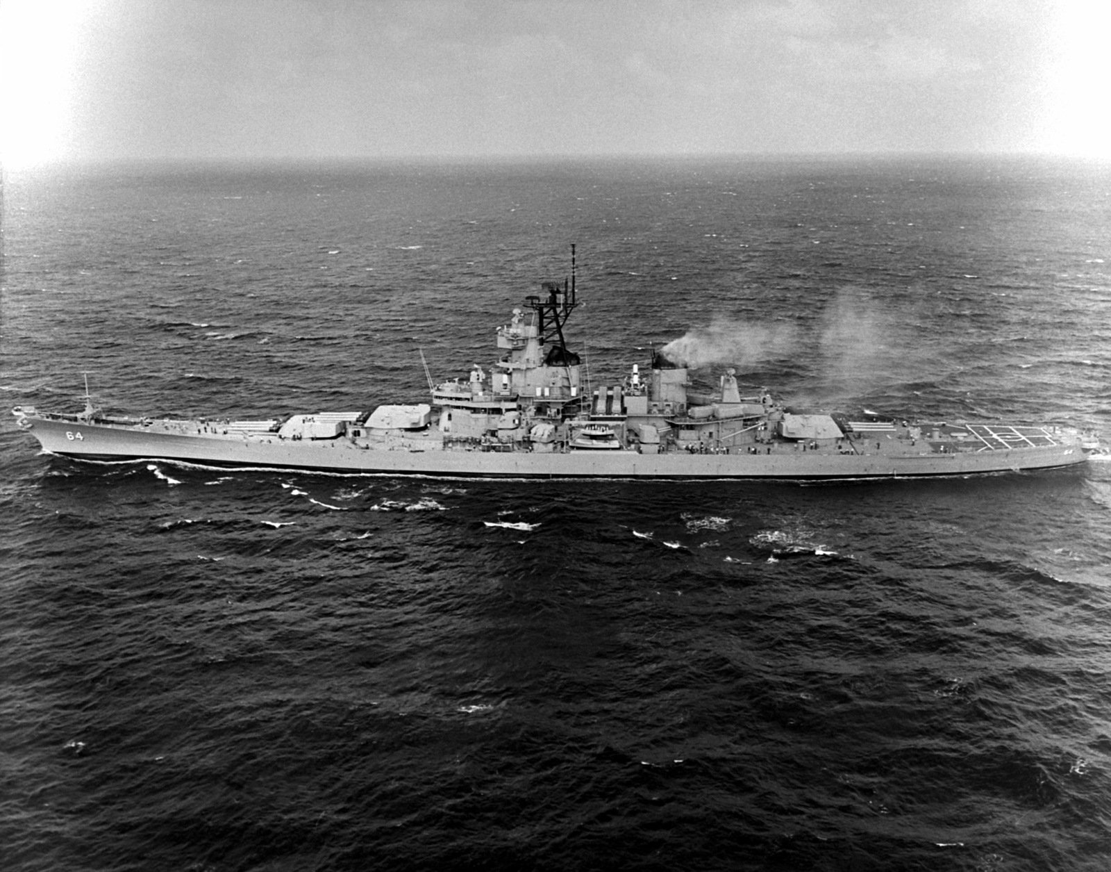 A port beam view of the battleship WISCONSIN (BB-64 underway during sea ...