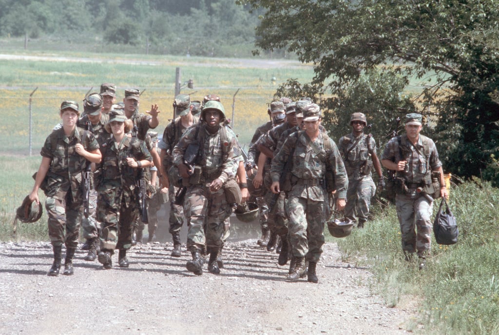 Members of the 437th Security Police Squadron march to their quarters ...