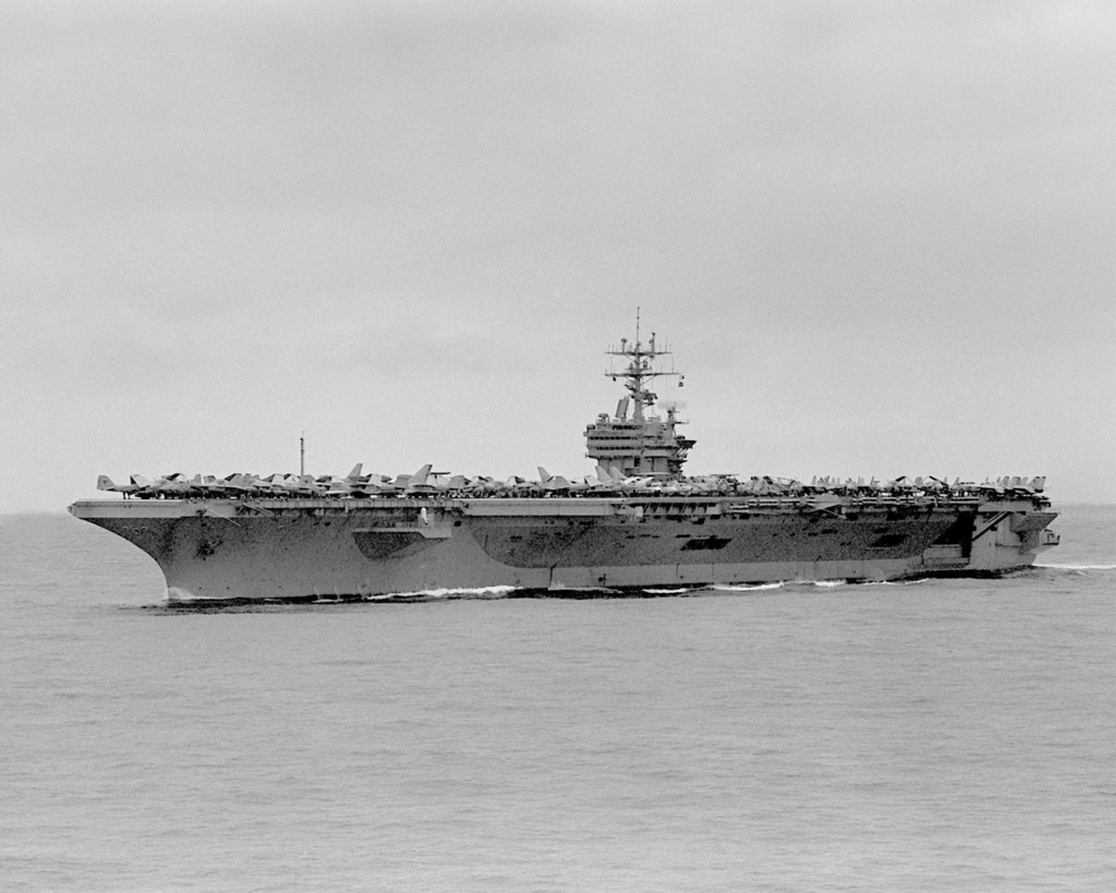 A port view of the nuclear-powered aircraft carrier USS THEODORE ...