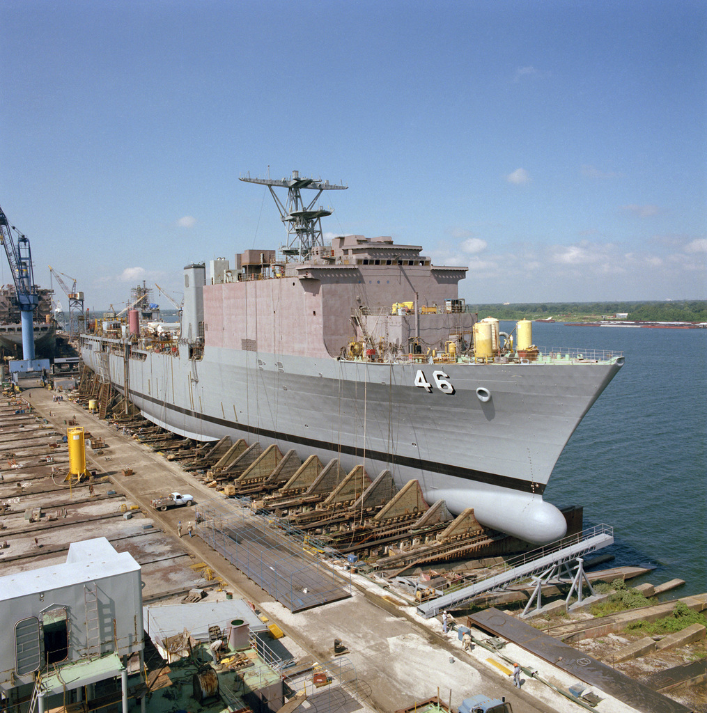 The dock landing ship USS TORTUGA (LSC 46) rests on the ways while ...