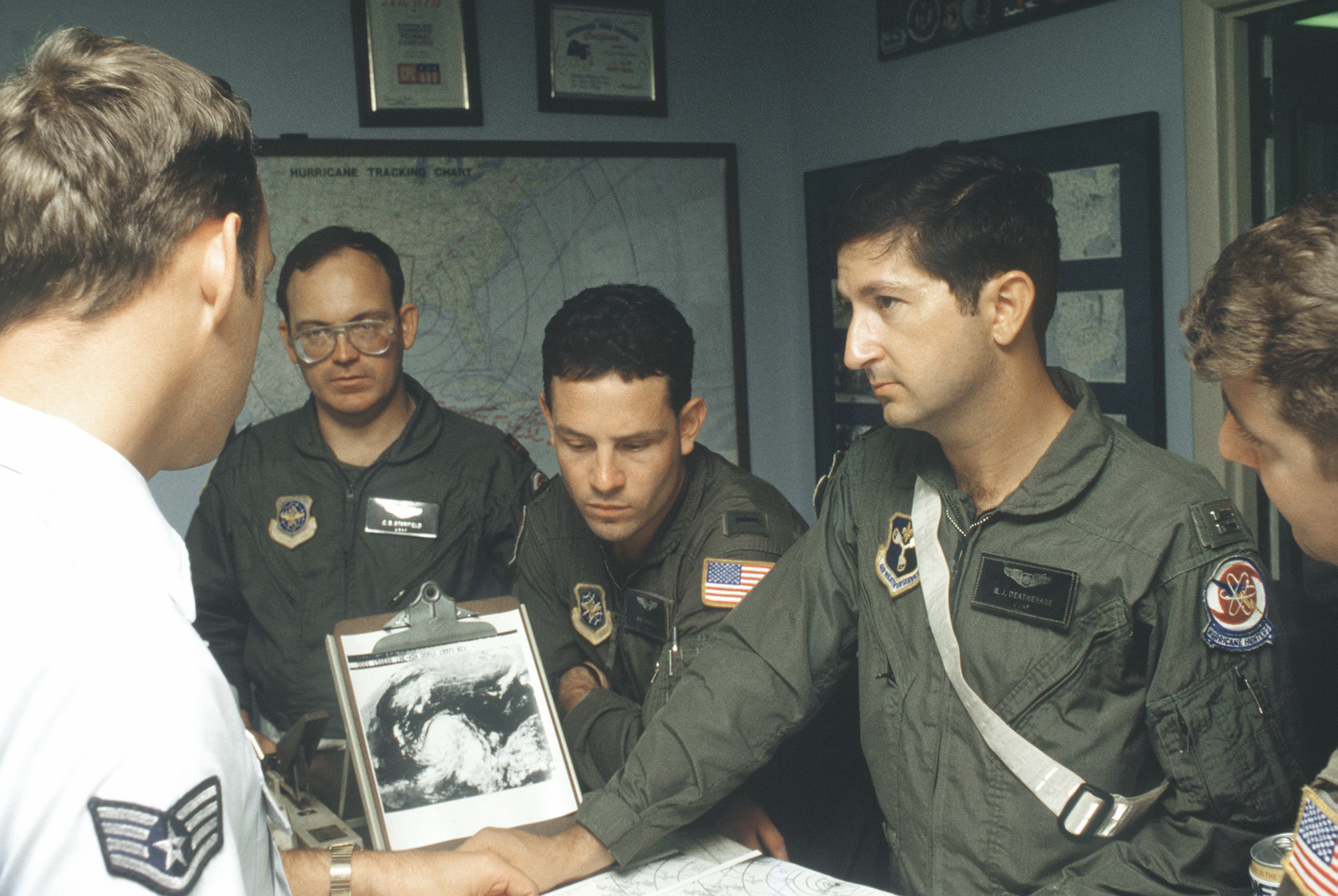 A WC-130H Hercules aircraft crew from the 53rd Weather Reconnaissance ...