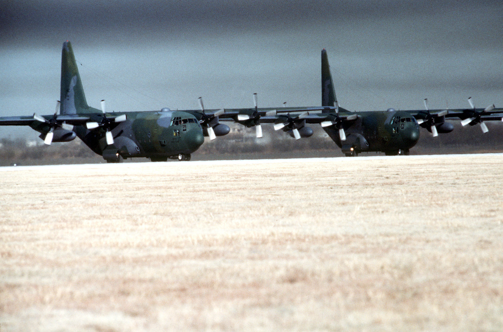 Two of the 463rd Tactical Airlift Wing C-130 Hercules aircraft ...