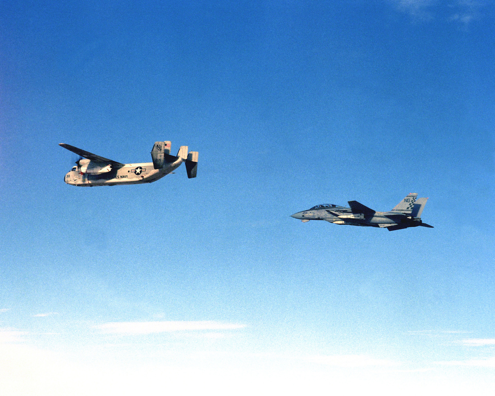 A Fighter Squadron 211 Vf 211 F 14a Tomcat Aircraft Flies Behind A Carrier Airborne Early