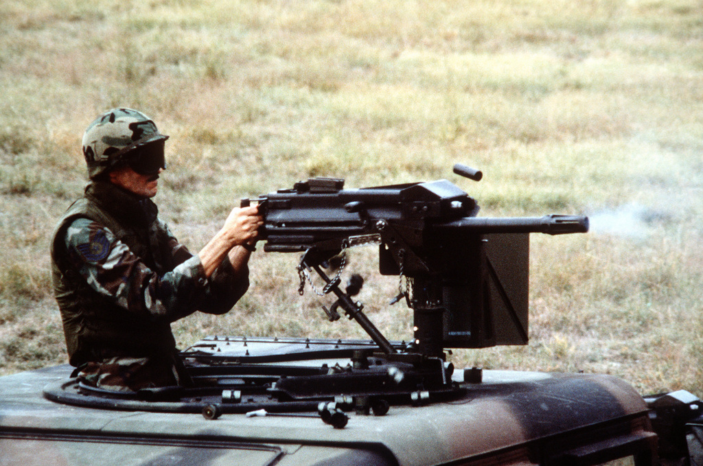 During A Training Operation A Security Policeman Fires The Browning M 2 50 Cal Machine Gun Mounted On A Fast Moving High Mobility Multipurpose Wheeled Vehicle Hmmwv Exact Date Shot Unknown Picryl Public