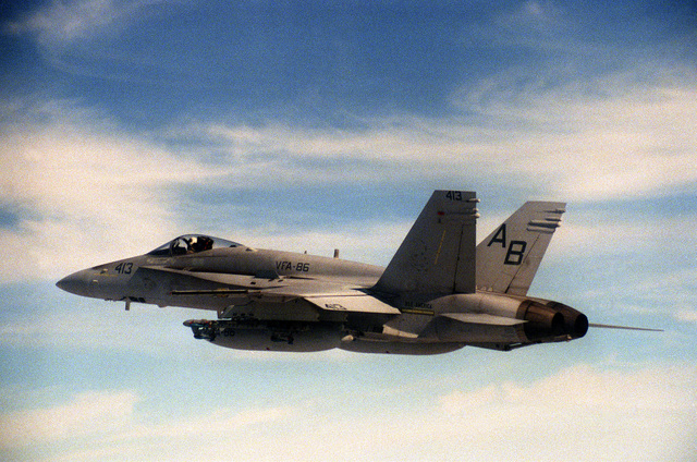 An air-to-air left side view of a Strike Fighter Squadron (VFA-86) F/A ...