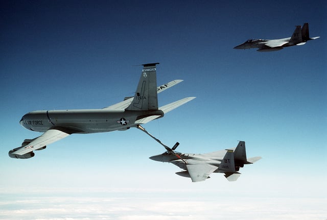 A 53rd Tactical Fighter Squadron F-15C Eagle aircraft refuels from a KC ...