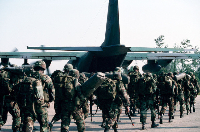 Soldiers From The 101st Airborne Division File Aboard A C-130 Hercules ...