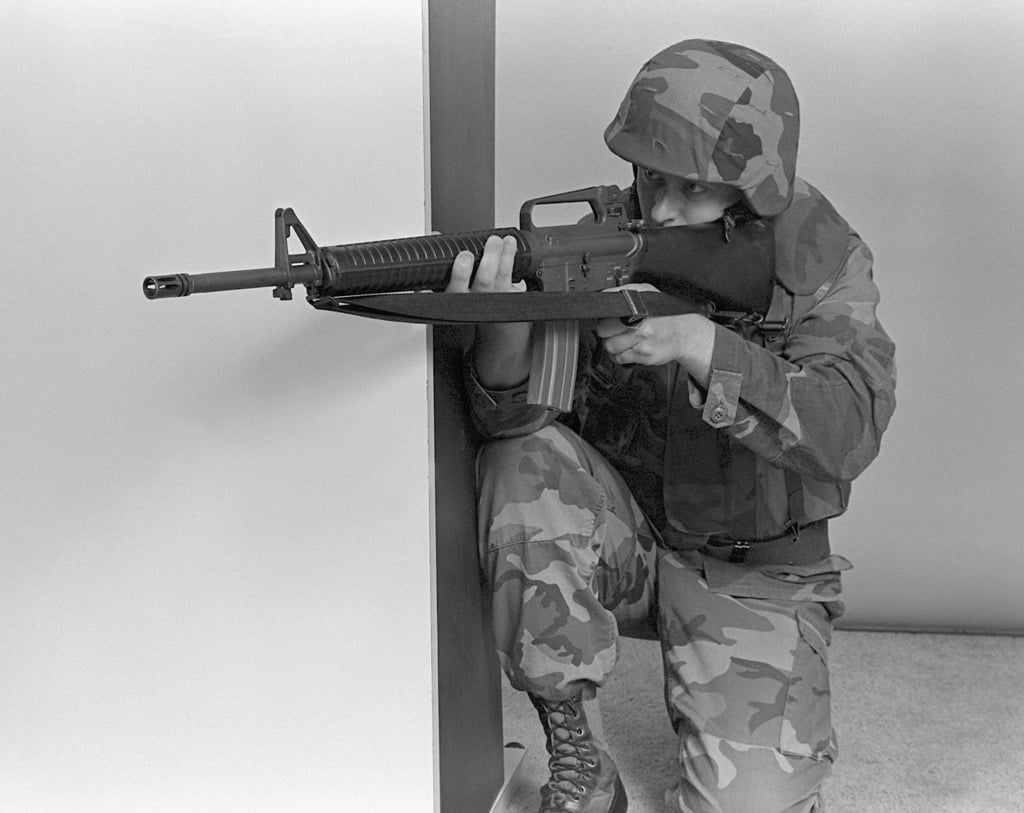 a-marine-demonstrates-a-kneeling-firing-position-with-an-m-16a2-5-56mm