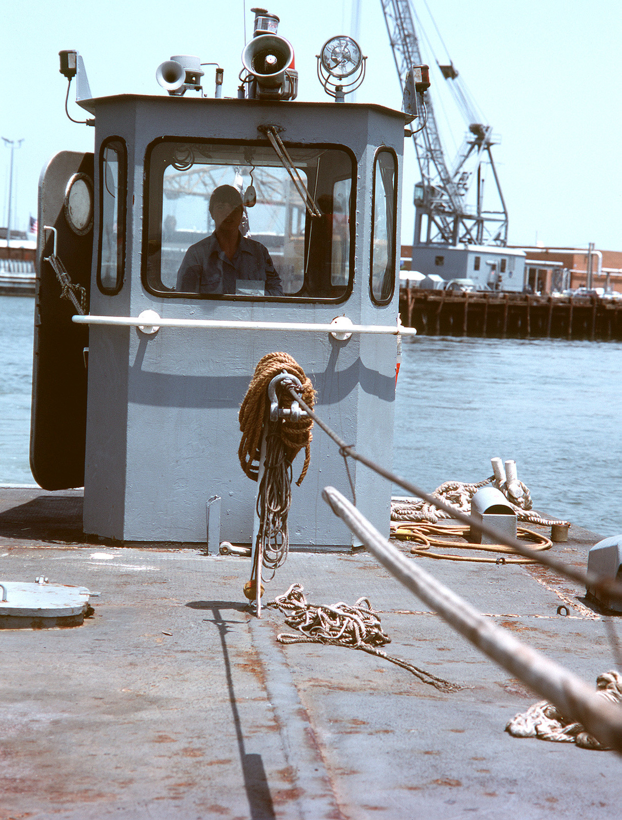 a-petty-officer-2nd-class-serves-as-coxswain-of-an-lcm-8-mechanized