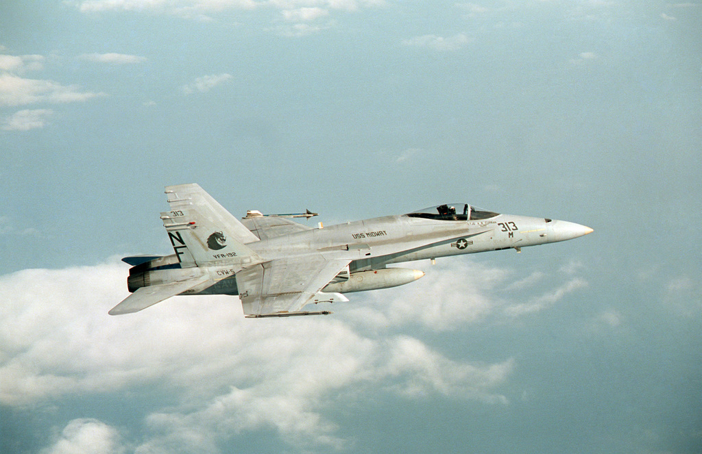 An air-to-air right side view of an F/A-18A Hornet aircraft from Strike ...