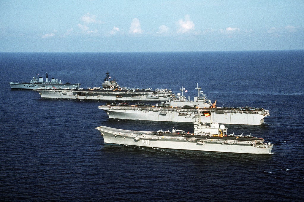 A starboard quarter view of the aircraft carrier USS FORRESTAL (CV-59 ...