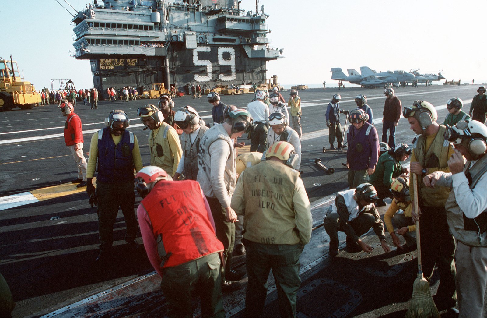 Flight deck personnel aboard the aircraft carrier USS FORRESTAL (CV 59 ...