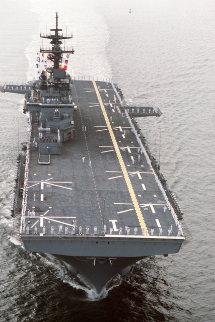 A bow view of the Amphibious Assault Ship USS WASP (LHD 1) with crewmen ...