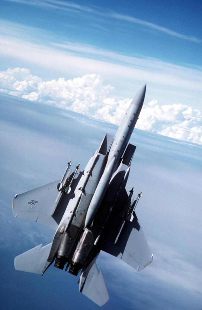 A 33rd Tactical Fighter Wing F-15C Eagle aircraft pulls into a climb ...