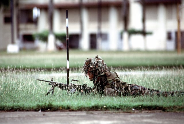 A Member Of A Quick Reaction Force Carrying An M249 Squad Automatic ...