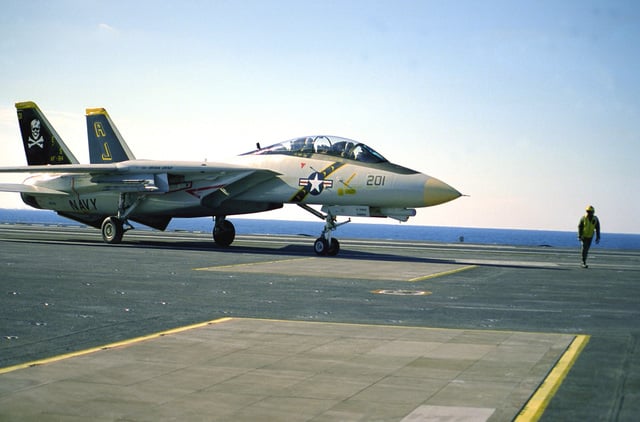 A Fighter Squadron 84 (VF-84) F-14A Tomcat aircraft stands on the ...