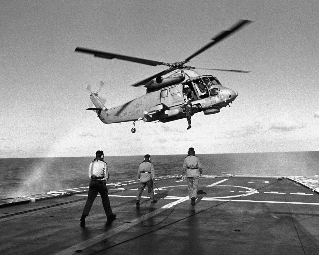 An American serviceman is lowered to the flight deck of the Dutch ...