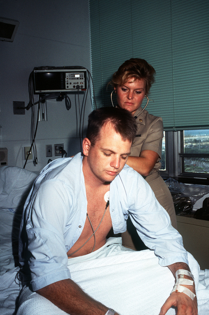 LT. Hoeger, a Navy doctor, listens to Harvey Mitchell's breathing in the  Intensive Care Unit of the U.S. Naval Hospital - PICRYL - Public Domain  Media Search Engine Public Domain Search