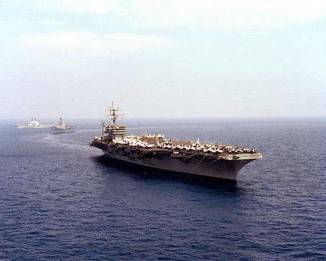 A starboard bow view of the nuclear-powered aircraft carrier USS DWIGHT ...