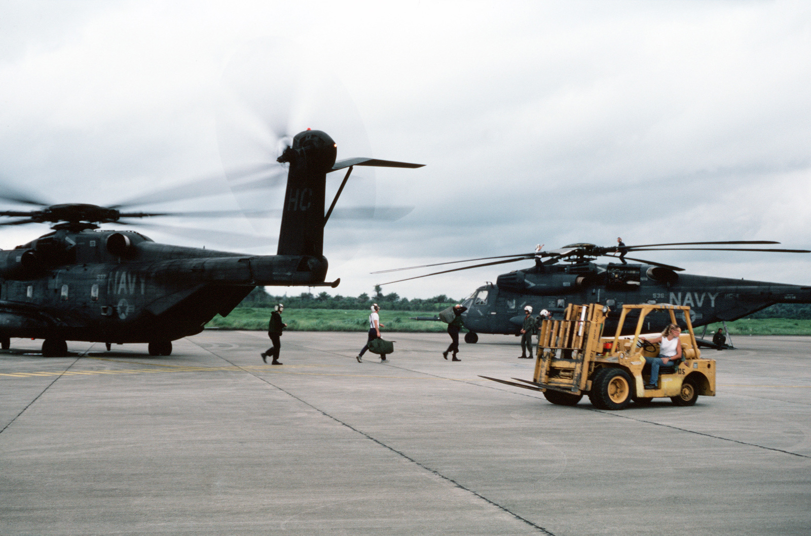 A Forklift Stands By To Transport Cargo From A Helicopter Combat Support Squadron 4 Hc 4