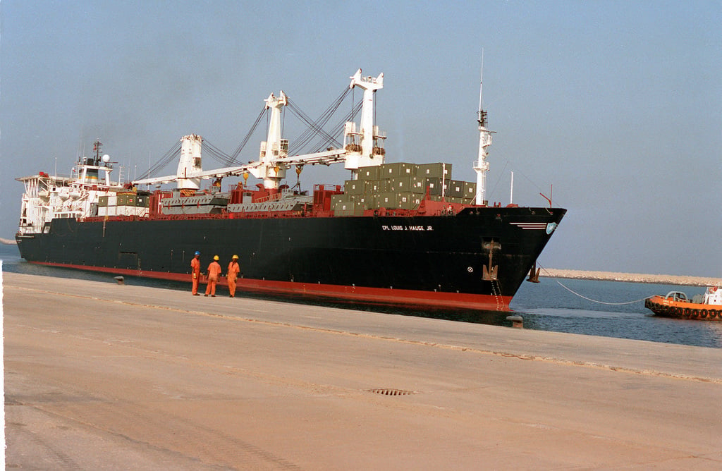 a-tug-boat-positions-the-vehicle-cargo-ship-cpl-louis-j-hauge-jr-t