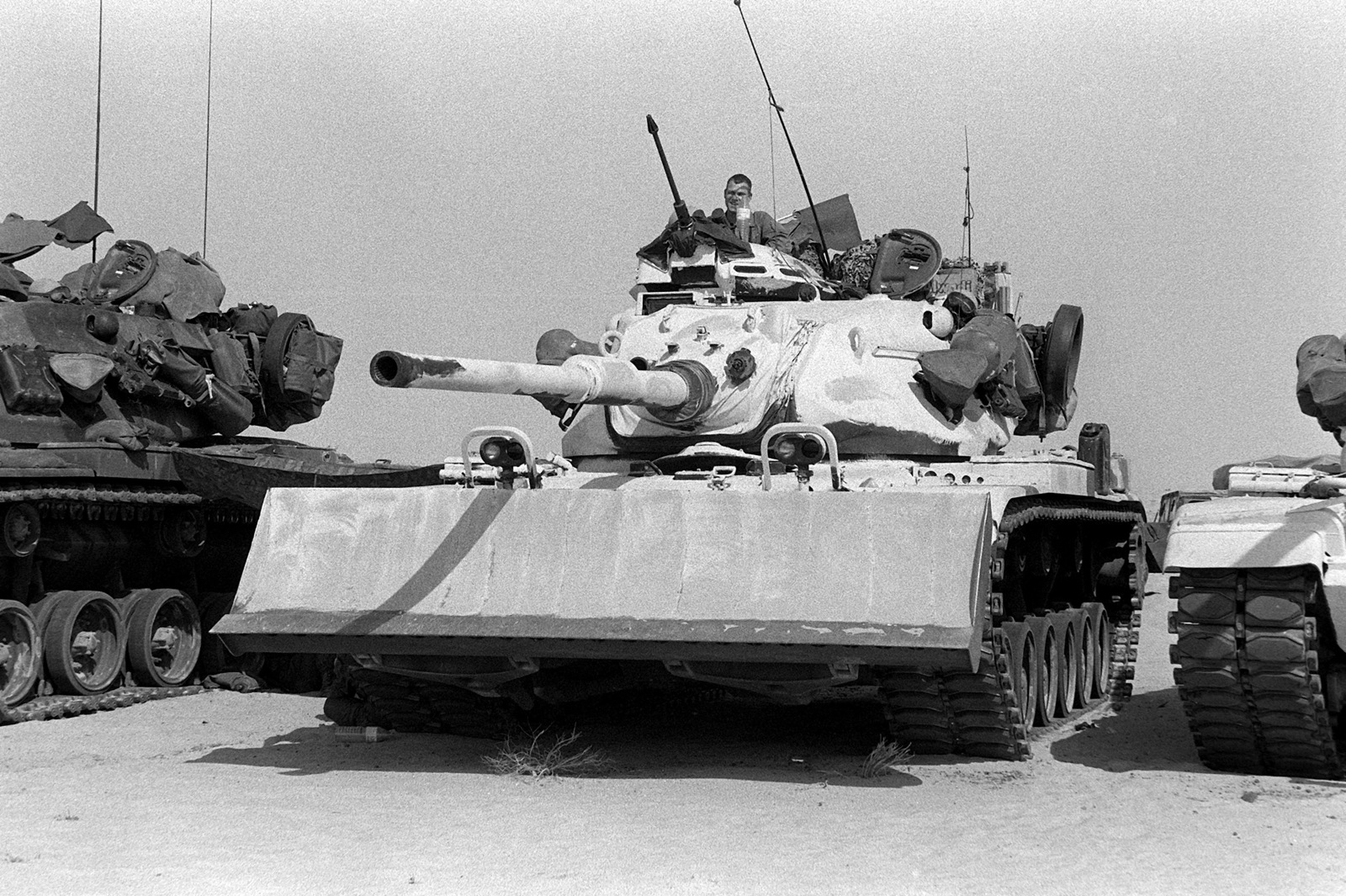 A Marine from the 1ST Tank Battalion stands in the commander's cupola ...