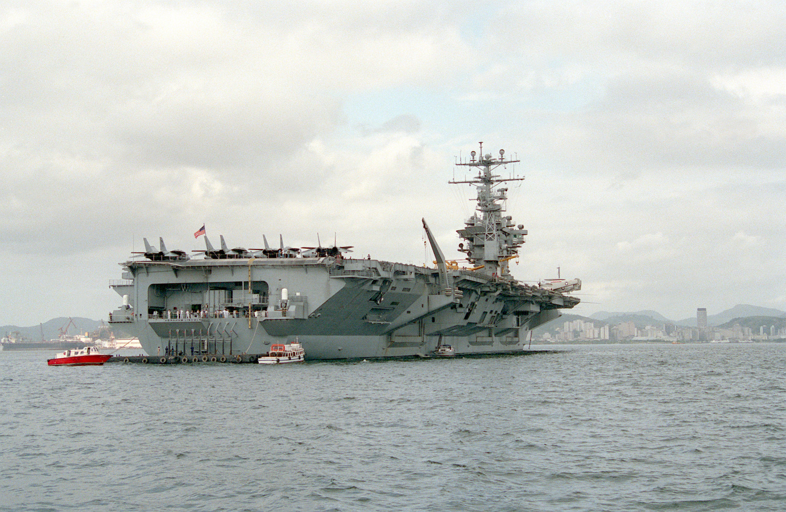 a stern view of the nuclear powered aircraft carrier uss abraham lincoln cvn 72 at anchor getarchive