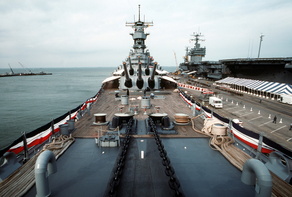 Sailors Work Aboard The Battleship USS IOWA (BB-61) Following The Ship ...