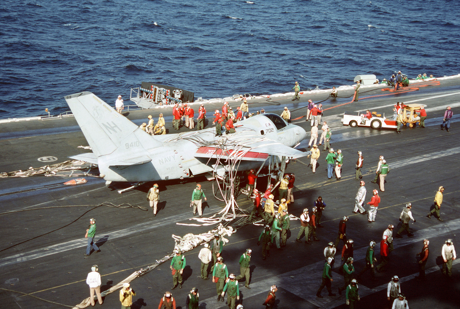 Crewmen Aboard The Nuclear-powered Aircraft Carrier USS ABRAHAM LINCOLN ...