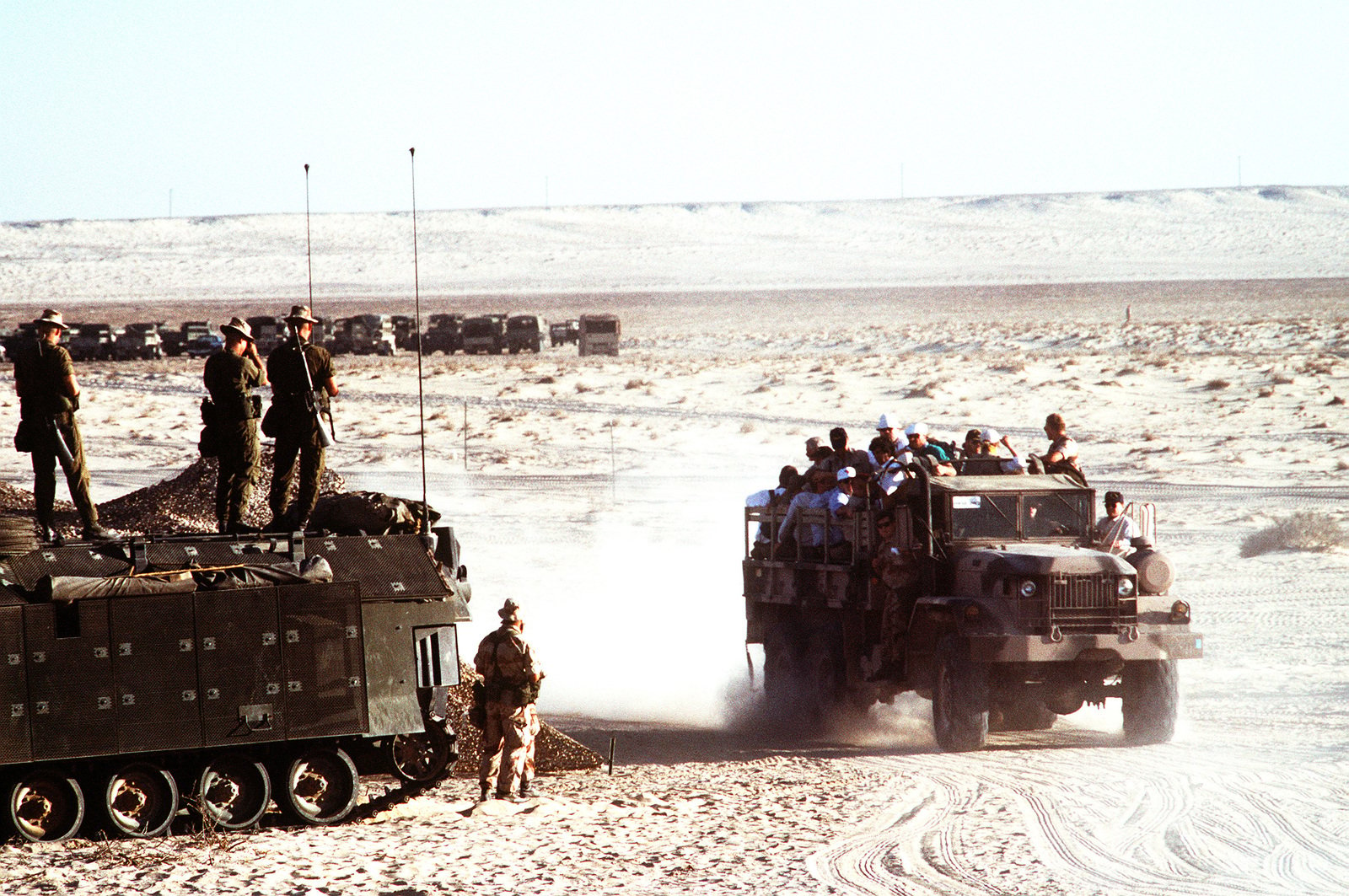 Marines standing atop an AAVP-7A1 amphibious assault vehicle watch as ...