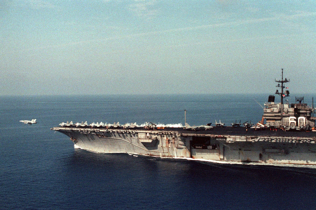 A partial port beam view of the aircraft carrier USS SARATOGA (CV-60 ...