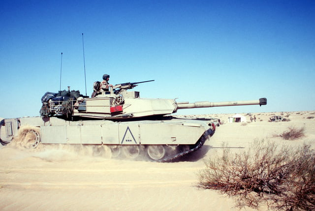 The Gunner Mans A Machine Gun From The Turret Of An M-1 Abrams Main 