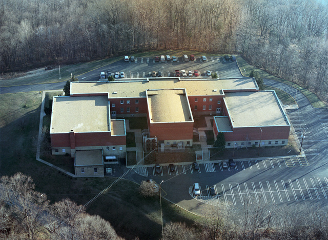 High oblique aerial view of the Amphibious Warfare School (AWS ...